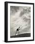 Young Boy Atop a Hill Hurls a Javelin into the Air-null-Framed Photographic Print