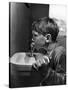 Young Boy Drinking from a Water Fountain-Allan Grant-Stretched Canvas