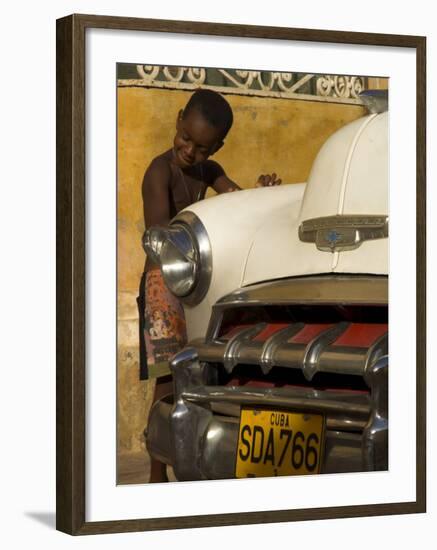 Young Boy Drumming on Old American Car's Bonnet,Trinidad, Sancti Spiritus Province, Cuba-Eitan Simanor-Framed Photographic Print