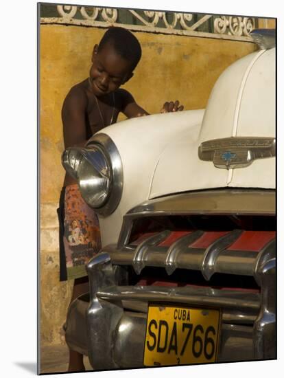Young Boy Drumming on Old American Car's Bonnet,Trinidad, Sancti Spiritus Province, Cuba-Eitan Simanor-Mounted Photographic Print