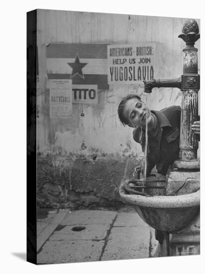 Young Boy Getting a Drink from Fountain in Trieste Region-Nat Farbman-Stretched Canvas