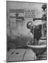 Young Boy Getting a Drink from Fountain in Trieste Region-Nat Farbman-Mounted Photographic Print