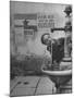 Young Boy Getting a Drink from Fountain in Trieste Region-Nat Farbman-Mounted Photographic Print