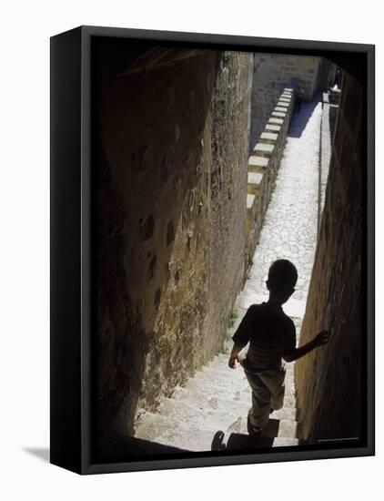 Young Boy in Tower of Castelo de Sao Jorge, Portgual-Merrill Images-Framed Stretched Canvas