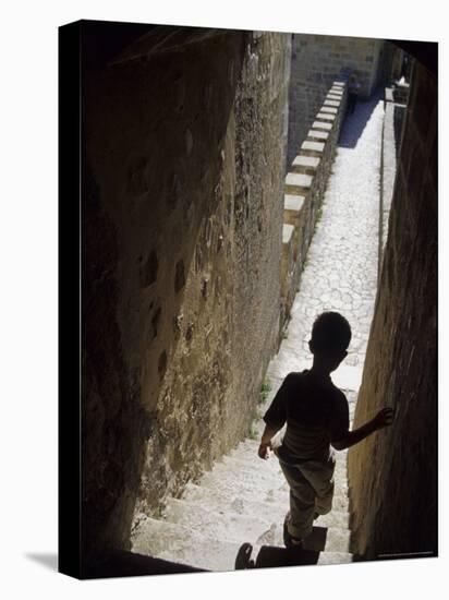 Young Boy in Tower of Castelo de Sao Jorge, Portgual-Merrill Images-Stretched Canvas
