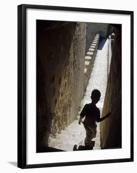 Young Boy in Tower of Castelo de Sao Jorge, Portgual-Merrill Images-Framed Photographic Print