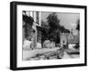 Young boy looking in shop window in the Cotswolds, 1935-Bernard Alfieri-Framed Photographic Print