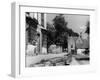 Young boy looking in shop window in the Cotswolds, 1935-Bernard Alfieri-Framed Photographic Print