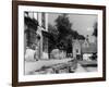 Young boy looking in shop window in the Cotswolds, 1935-Bernard Alfieri-Framed Photographic Print