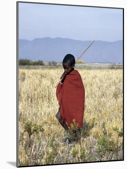 Young Boy of the Datoga Tribe Crosses the Plains East of Lake Manyara in Northern Tanzania-Nigel Pavitt-Mounted Photographic Print