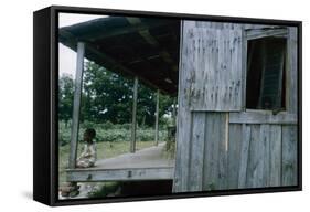 Young Boy on the Porch and a Second Boy Looking Out of Window, on Edisto Island, South Carolina-Walter Sanders-Framed Stretched Canvas