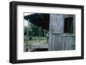 Young Boy on the Porch and a Second Boy Looking Out of Window, on Edisto Island, South Carolina-Walter Sanders-Framed Photographic Print