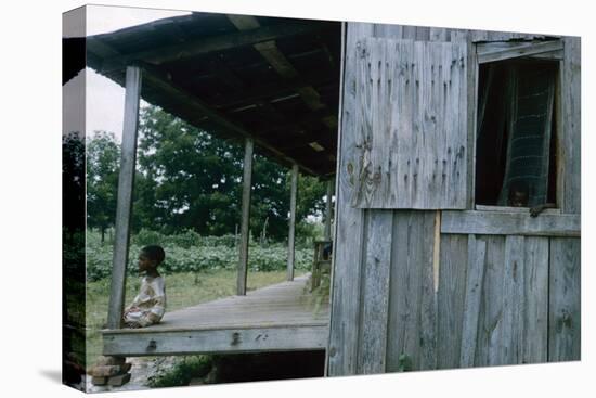 Young Boy on the Porch and a Second Boy Looking Out of Window, on Edisto Island, South Carolina-Walter Sanders-Stretched Canvas