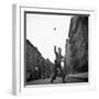 Young Boy Pitching Ball on a City Street-Cornell Capa-Framed Photographic Print