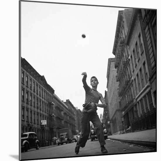 Young Boy Pitching Ball on a City Street-Cornell Capa-Mounted Photographic Print