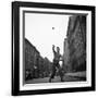 Young Boy Pitching Ball on a City Street-Cornell Capa-Framed Photographic Print