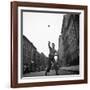 Young Boy Pitching Ball on a City Street-Cornell Capa-Framed Photographic Print