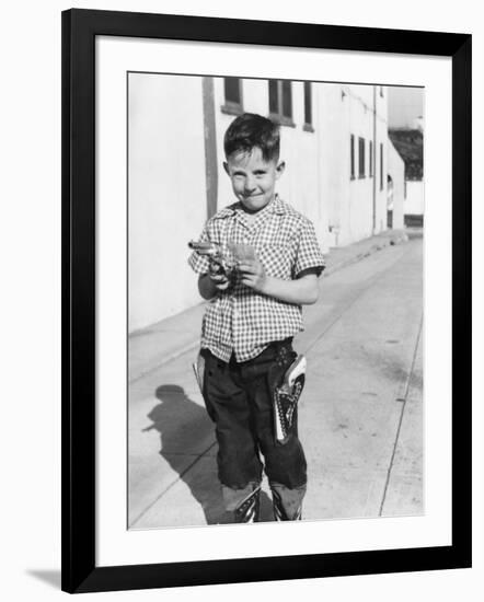 Young Boy Plays Cowboy in a California Alley, Ca. 1952-null-Framed Photographic Print