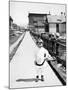 Young Boy Plays on a New Colorado Sidewalk, Ca. 1910-null-Mounted Photographic Print