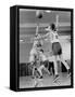 Young Boy Shooting a Free-Throw Shot over the Head of Another Young Boy-null-Framed Stretched Canvas