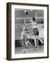 Young Boy Shooting a Free-Throw Shot over the Head of Another Young Boy-null-Framed Premium Photographic Print