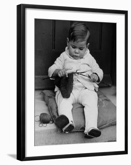 Young Boy Trying to Use Knitting Needles During Drive to Provide Woolen Goods for Servicemen-null-Framed Photographic Print