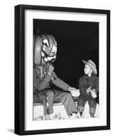 Young Boy Warily Eyes Pumpkin Man, Ca. 1955-null-Framed Photographic Print