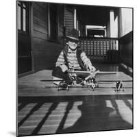 Young Boy with His Model Airplanes, Ca. 1932.-Kirn Vintage Stock-Mounted Photographic Print