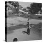 Young Boys Playing Baseball-null-Stretched Canvas