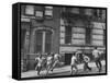 Young Boys with Sticks, Running Around While Playing a Street Game in Spanish Harlem-Ralph Morse-Framed Stretched Canvas