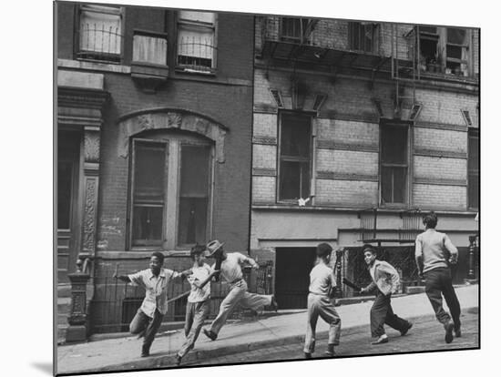 Young Boys with Sticks, Running Around While Playing a Street Game in Spanish Harlem-Ralph Morse-Mounted Photographic Print