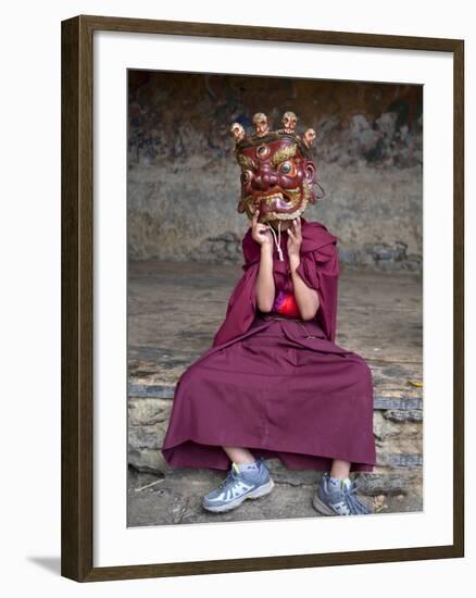 Young Buddhist Monk Holding Traditional Carved Wooden Mask to His Face at the Tamshing Phala Choepa-Lee Frost-Framed Photographic Print