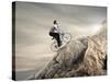 Young Businessman Pedaling a Bicycle on the Rocks-olly2-Stretched Canvas