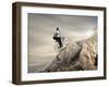 Young Businessman Pedaling a Bicycle on the Rocks-olly2-Framed Photographic Print