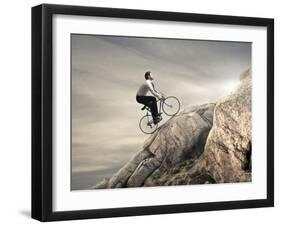 Young Businessman Pedaling a Bicycle on the Rocks-olly2-Framed Photographic Print