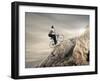 Young Businessman Pedaling a Bicycle on the Rocks-olly2-Framed Photographic Print