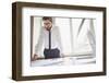 Young Businessman Standing by the Window in Office and Working with Papers-pressmaster-Framed Photographic Print