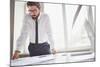 Young Businessman Standing by the Window in Office and Working with Papers-pressmaster-Mounted Photographic Print