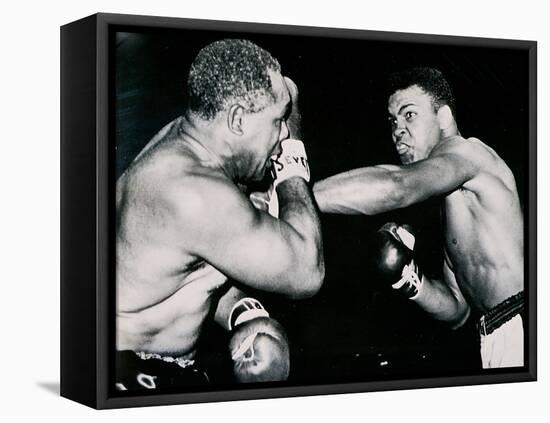 Young Cassius Clay Scores with a Left Against the Veteran Archie Moore in the First Round of the?-American Photographer-Framed Stretched Canvas