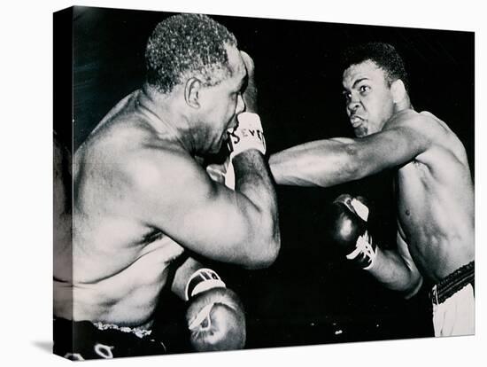 Young Cassius Clay Scores with a Left Against the Veteran Archie Moore in the First Round of the?-American Photographer-Stretched Canvas