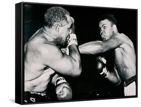 Young Cassius Clay Scores with a Left Against the Veteran Archie Moore in the First Round of the?-American Photographer-Framed Stretched Canvas