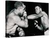 Young Cassius Clay Scores with a Left Against the Veteran Archie Moore in the First Round of the?-American Photographer-Stretched Canvas