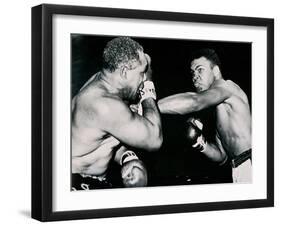 Young Cassius Clay Scores with a Left Against the Veteran Archie Moore in the First Round of the?-American Photographer-Framed Premium Photographic Print