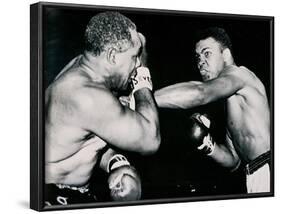 Young Cassius Clay Scores with a Left Against the Veteran Archie Moore in the First Round of the?-American Photographer-Framed Photographic Print