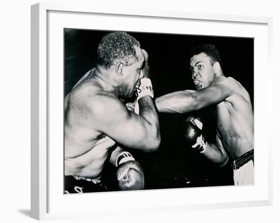 Young Cassius Clay Scores with a Left Against the Veteran Archie Moore in the First Round of the?-American Photographer-Framed Photographic Print