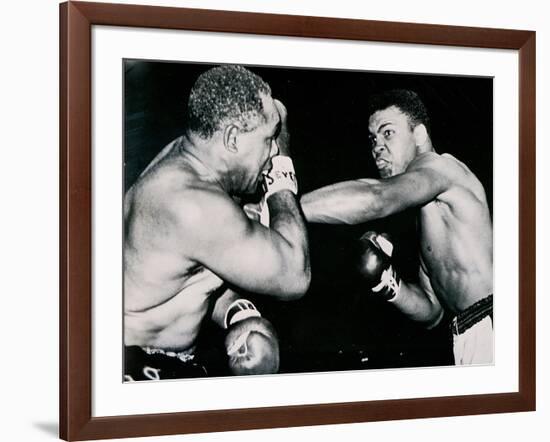 Young Cassius Clay Scores with a Left Against the Veteran Archie Moore in the First Round of the?-American Photographer-Framed Photographic Print