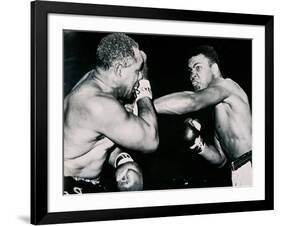 Young Cassius Clay Scores with a Left Against the Veteran Archie Moore in the First Round of the?-American Photographer-Framed Photographic Print