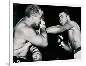 Young Cassius Clay Scores with a Left Against the Veteran Archie Moore in the First Round of the?-American Photographer-Framed Photographic Print