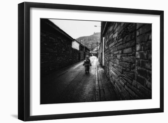 Young Child Walking Down Street-Clive Nolan-Framed Photographic Print