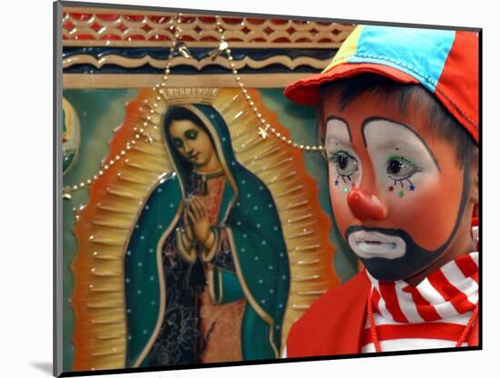 Young Clown, "Bolillito," Stands Next to an Image of the Virgin of Guadalupe in Mexico City-null-Mounted Photographic Print